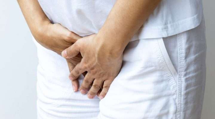 Elderly woman experiencing urinary incontinence discomfort, seeking treatment in Charlotte, NC
